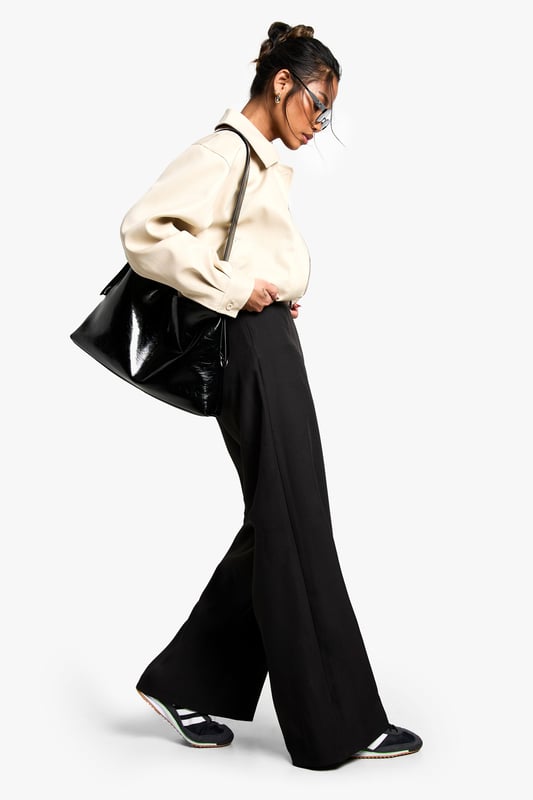 Get your new wide or die pants with the hottest style of the season, the wide leg trouser. Elongate your silhouette with the flattering shape the high waist wide leg trouser has to offer. Team with a tucked in slogan tee and trainers for sports luxe vibes or partner perfectly with a blazer and heels for your next event. It's time to upgrade your day-to-day outfits with a pair of palazzo pants.Style: Wide Leg TrousersDesign: PlainFabric: WovenLength: Stacked