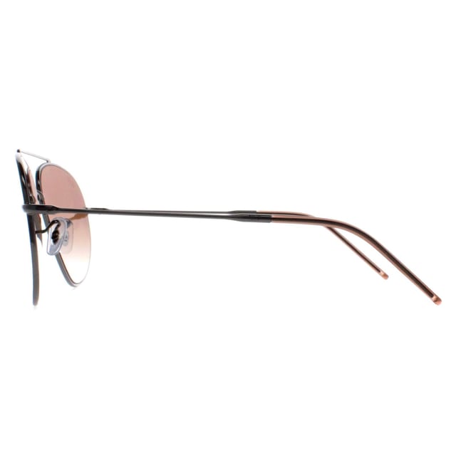 Ray-Ban Aviator Unisex Gunmetal Brown Gradient RB0101S Aviator Reverse  Sunglasses are a captivating reimagination of the classic aviator design. Crafted with meticulous attention to detail, these sunglasses feature a striking reverse color scheme, accentuating the iconic teardrop-shaped lenses and sleek metal frame. The bold contrast of colors adds a contemporary edge while maintaining the timeless appeal of the Aviator style. Engineered for both style and durability, these sunglasses offer superior UV protection and comfort, making them an essential accessory for those who appreciate fashion-forward design and unparalleled quality.