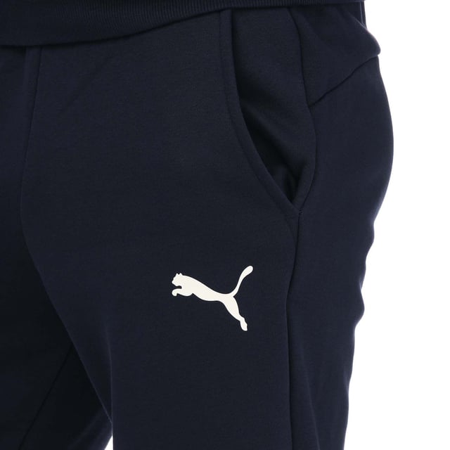 Mens Puma Essentials Logo Sweatpants in navy.- Elasticated waist with inner drawcord.- Two front pockets.- Ribbed ankle cuffs.- Printed branding.- Brushback fleece.- Regular fit.- Shell: 66% Cotton  34% Elastane. Rib: 97% Cotton  3% Elastane.- Ref: 58671476