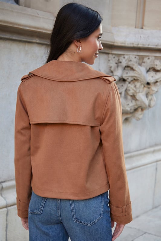 Get this coveted cropped suedette trench coat from Threadbare, a staple to complete your year-round outerwear collection. The classic trench comes in a short length and is made from a faux suede fabric. With a revere collar and double-breasted mock horn button fastening, this effortless throw-on trench coat has raglan sleeves with epaulettes for a tailored feel, and it's finished with button cuff straps and two front pockets for your essentials. Model wears UK size 8.
