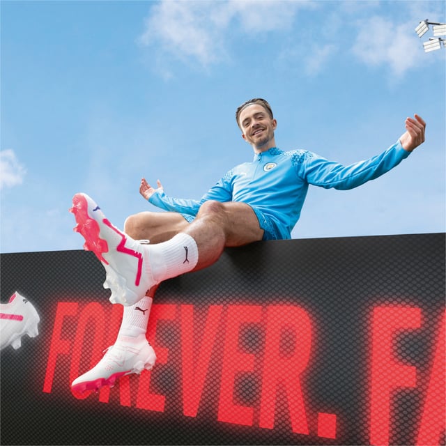 PRODUCT STORY : Calling all playmakers. Inspired by Neymar Jr’s style of play, the new FUTURE ULTIMATE is here so you can Drive Them Crazy. It has a FUZIONFIT360 upper with PWRTAPE support that locks you in for quick cuts and changes of pace. Dynamic Motion System provides more support at the heel, more flexibility at the forefoot, and more traction in every direction. The upper is textured with different levels of grip for dribbling, passing, and finishing, so you can make every play count. FEATURES & BENEFITS : The upper of this shoe is made with at least 20% recycled materials as a step toward a better future. DETAILS : FUZIONFIT360 upper combines engineered dual mesh, stretchy knit and supplemental PWRTAPE support Engineered 3D textures at key contact zones are optimized to enhance ball grip and control for dribbling, passing and finishing Super-lightweight Peba base material guarantees excellent wearing comfort Micro-perforated heel padding keeps the heel locked in and comfortable Lightweight removable sockliner with NanoGrip technology keeps the foot from slipping inside the boot Lightweight Dynamic Motion System outsole enhances traction and agility for unpredictable changes of pace and direction. Suitable for use on both firm natural surfaces and artificial grass (4G) FG/AG: Firm Ground/Artificial Ground Fits regular to wide feet Mid-cut boot.