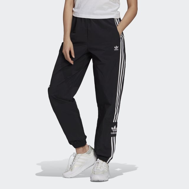No reason is too small to treat yourself. In fact, you don't even need a reason. And with these adidas track pants in your closet, you can treat yourself any minute of the day. They're all about comfort, which is exactly what you'll feel when you slip them on. This product is made with Primegreen, a series of high-performance recycled materials.  - Regular fit - Drawcord on elastic waist - 100% recycled nylon plain weave - Side zip pockets - Elastic cuffs - Primegreen  Shipped by adidas