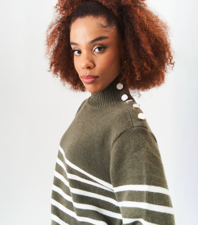 Stay cozy and stylish with ou High Neck Stripe Oversized Jumper. This fashionable sweater features a high neck design and classic stripes, perfect for any fashion-forward individual. The oversized fit adds a touch of trendiness to your wardrobe. Stay warm and look great all season long.MeasurementApprox. length- 75cm