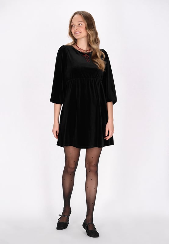 Step into style with this babydoll dress, crafted from luxurious velvet for a plush feel. It showcases a round neck and 3/4 puff sleeves that add charm to your look. The elastic waist creates delicate gathering, enhancing the festive vibe. Ideal for Christmas or any event. This mini dress offers effortless elegance in a plain pattern. This article is a part of the Mini Dress Collection.  Kleid
