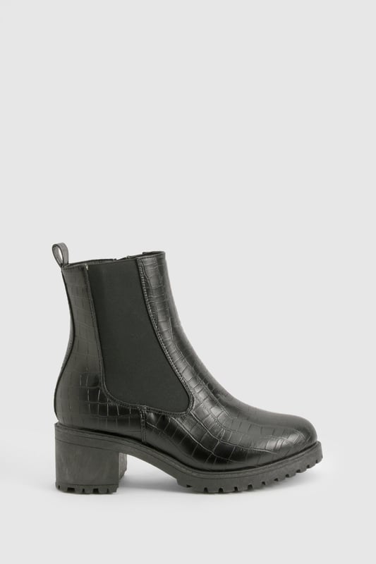 Crocodile-embossed texture for a luxe finish
        Chelsea-style with elastic side panels for easy on-off
        Chunky block heel measuring between 2.5 and 4.5cm
        Pull tab at the back for convenient wear
        Durable treaded sole for enhanced grip
    
    Step out in style with these versatile Chelsea boots, perfect for the fashion-forward woman who values both comfort and trend-setting looks. The crocodile-embossed texture adds a touch of sophistication to any outfit, while the elastic side panels ensure a snug fit and easy wear. Pair these boots with skinny jeans and an oversized jumper for a casual day out, or dress them up with a flowy midi skirt and leather jacket for an evening with friends. The low block heel offers just the right amount of lift without compromising on comfort, making these boots ideal for all-day wear. Whether you're heading to a family gathering or a casual catch-up with mates, these Chelsea boots will keep you looking effortlessly chic and feeling confident. Their robust construction and timeless design make them a wardrobe staple that you'll reach for season after season.