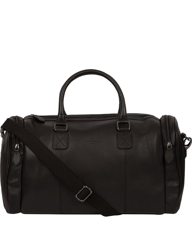 Crafted from natural leather with a supple and ultra-soft feel, the 'Ocean' holdall from Cultured London is the perfect bag for a when travel is on the agenda. The zip-over top secures the main compartment, concealing the 100% natural cotton lining. Two outer zipped pockets provide extra storage solutions, complemented by metal fittings. Comes with matching leather grab handles and an adjustable strap with a drop length of 70cm. Finished with the contemporary embossed Cultured London logo.