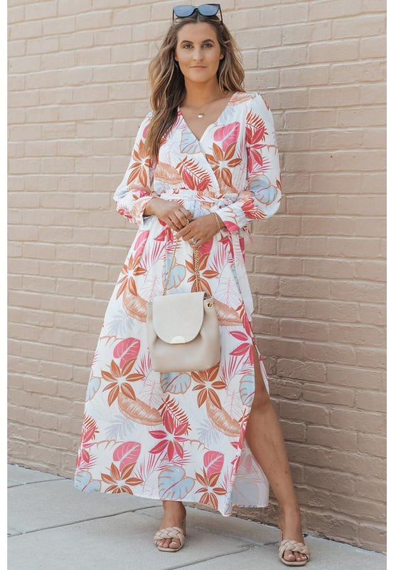 Tropical plant print adds a touch of nature
  Long sleeves provide coverage
  Wrap design and V-neckline create a flattering silhouette
  Slit detail adds a hint of allure
  Made from Quality materials
  Suitable for both casual and formal occasions