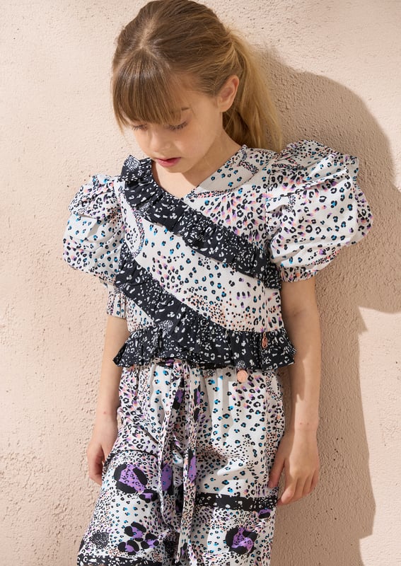 Statement sleeve - tick. Animal print - tick. Playful ruffles - tick. This top has it all. Wear with our Estelle trouser for the ultimate co-ord!.