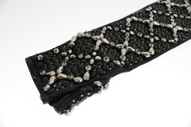 Gorgeous brand new with tags
  100% Authentic Dolce & Gabbana black leather
  Finger-free design
  Elbow length
  Black color with black and silver crystal beads
  Logo details
  Limited edition
  Made in Italy
Material: 100% Leather