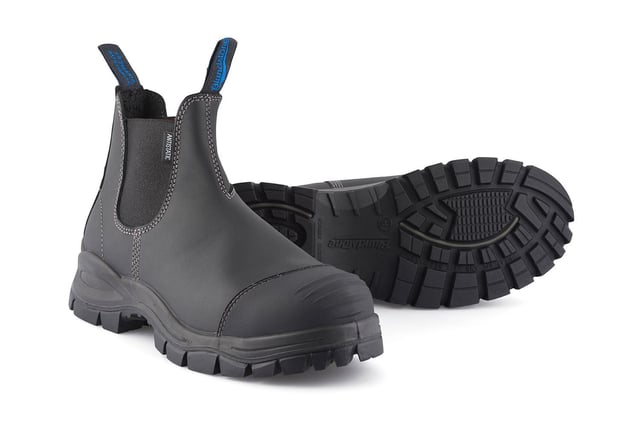 The ultimate workplace boot, these Blundstone 910 safety boots provide all-day support, comfort and protection. Made from premium, durable platinum black leather uppers with a CES3 safety rating, a low shaft with an elasticated side for easy slip-on and a hardened steel toe cap, these Blundstone 910 boots are the ultimate everyday boot. These 910 boots are the result of decades of experience in crafting the highest-quality Australian footwear and whether it be at home, work or anywhere else life takes, these Blundstone boots are a perfect choice.Designed with Blundstones patented shock protection system (SPS) and manufactured with a Thermo urethane outsole and polyurethane midsoles, these 910 boots are built to withstand anything you can throw at it. They also come with a hardened broad fitting steel toe capable cap of resisting a 200 Joule impact with additional kick guard toe protection to ensure your safety is never compromised. However, safety does not come at the expense of comfort with these Blundstone boots; they are made with a steel shank for added support on uneven terrain in addition to a toe spring to help reduce fatigue over long periods of use. Details  Broad fitting steel-toe cap resistant to impacts over 200 Joules Genuine black leather uppers that are oil, acid and organic fat resistant Ergonomically engineered toe spring to help prevent wearer fatigue Full heel breast with arch support to ensure safety on ladders and gantries Highly durable PU midsole and TPU outsole are strongly resistant to hydrolysis and microbial attack Made with Blundstone's patented SPS and XRD™ Technology for increased shock protection Removable Xtreme comfort EVA footbed provides all-day underfoot comfort The V Cut upper reduces stitching exposure and ensures long-lasting durability of these Blundstone boots Outsole resistant to temperatures of up to 140F/60C Low shaft elasticated side for easy slip-on Kickguard toe leather protection Firm supporting steel shank helps with torsional stability on uneven terrains