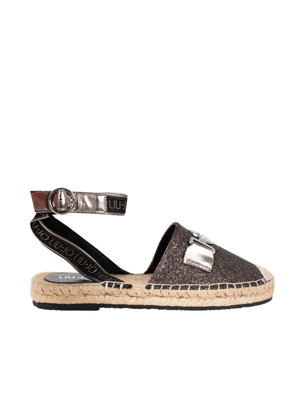 Estos elegantes zapatos, que se cierran alrededor del tobillo, garantizan no solo un estilo excepcional, sino también estabilidad y comodidad de uso durante todo el día.

Su puntera redonda proporciona un aspecto clásico, perfecto para una variedad de estilos, desde los cotidianos hasta las ocasiones más formales.

En la parte frontal del zapato se encuentra un detalle de la marca, que subraya la autenticidad y alta calidad del producto, añadiéndole un carácter prestigioso.

Decorados con purpurina, atraen la atención y añaden brillo a cada paso, ideales para aquellos que quieren destacarse.

Hechos de cuero ecológico de alta calidad, estos zapatos no solo son estilosos, sino también una elección consciente para los que se preocupan por el medio ambiente.

El forro y la plantilla hechos de cuero natural y ecológico proporcionan un confort inigualable y soporte para el pie, combinando lujo con un enfoque ecológico.

Empaquetados en una caja de la marca, estos zapatos están listos para ser regalados o como un elegante complemento para su propio armario.