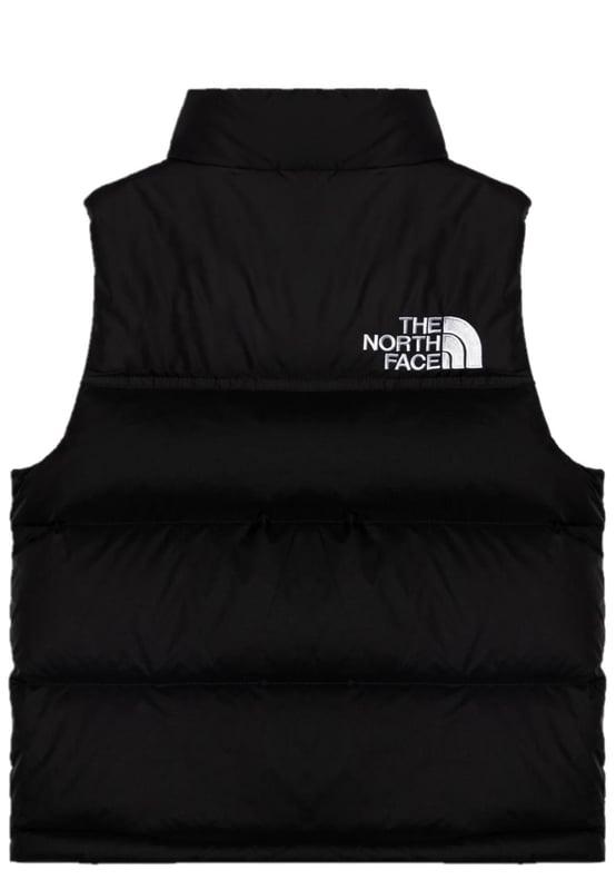 The North Face Nuptse has been delivering game-changing warmth since 1992 and no other jacket has journeyed so naturally from the mountains to city streets. - - .   The Teens' 1996 Retro Nuptse Gilet is a modern reincarnation of the icon, built for young adults. - - .  We’ve kept most things the same: the same boxy silhouette; the same shiny ripstop fabric; the same exposed zip and diagonal hand pockets and, of course, the same oversized baffles. - - .  The only change is upgrading to 700-fill of responsibly sourced down. - - .  It's also made with recycled materials, making it kinder to nature. - - . Shell: 100% Nylon, Lining: 100% Polyester, Filling: 90% Down, 10% Waterfowl Feathers.