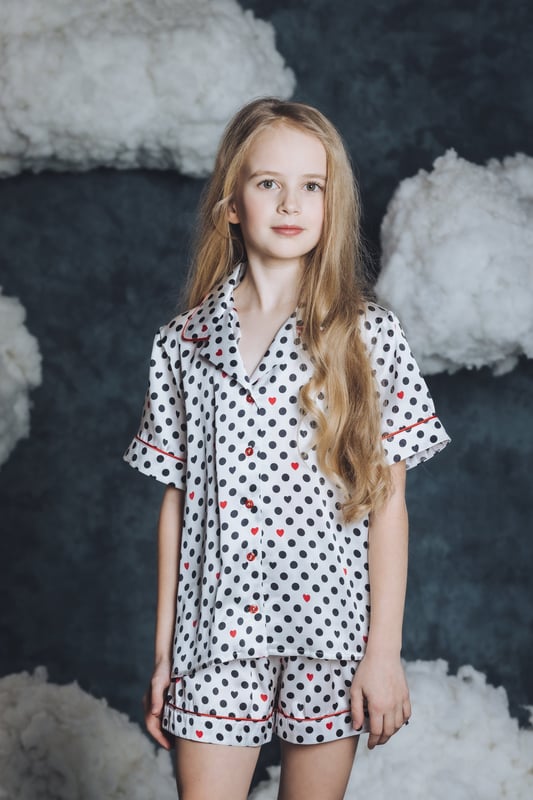 Introducing Amiki's Girls Silk Cassandra Pyjama Set in White ‚ an epitome of elegance and class perfect for your little one's. Key features include: Superior Quality: Crafted from pure silk, guaranteeing a luxurious and smooth touch against your child's delicate skin.  Sophisticated Design: This all-white silk pyjama set screams chic, while its feminine frills and details elevate its glamour.  Comfort Meets Style: Convenient without compromising elegance, ensuring your child feels fabulous even during slumber.  Perfect Gift Choice: The Cassandra Pyjama Set makes a perfect surprise for birthdays or special occasions. Classy, comfortable and chic - redefining sleepwear for little fashionistas.