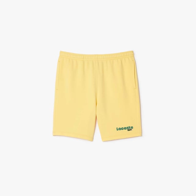Washed Effect Lacoste Print Jogger Shorts Organic cotton fleece Regular fit  straight cut  Drawstring waist Contrast Lacoste print Embroidered crocodile on front Washed Effect Lacoste Print Jogger Shorts Organic cotton fleece Regular fit  straight cut  Drawstring waist Contrast Lacoste print Embroidered crocodile on front