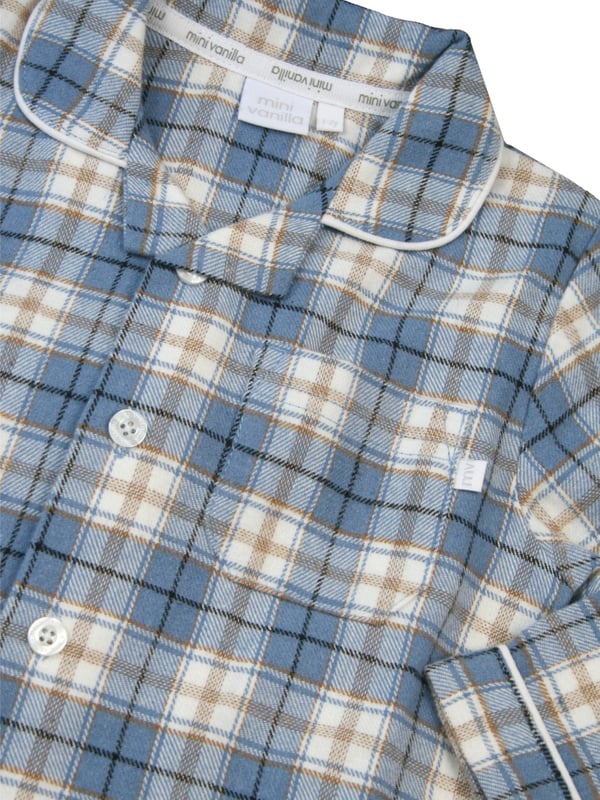 Boys blue check cotton pyjamas blending comfort and style seamlessly. These cosy pyjamas, made from soft, breathable cotton, are prefect for a restful night's sleep or casual lounging. The timeless faded denim blue with caramel and ivory check adds a touch of charm and sophistication to betimes making it a delightful experience for your young lad. Step into a world of comfort and fashion with these classic pyjamas, designed for your boy's relaxation and peaceful nights sleep!