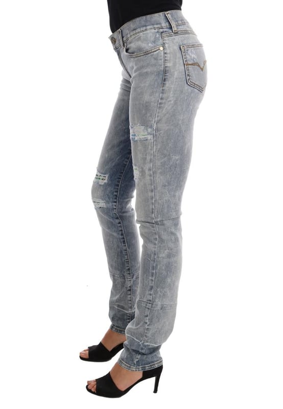 Absolutely stunning 100% Authentic brand new with tags
  Blue wash and torn cotton stretch jeans
  Mid waist slim fit
  Light blue wash
  Torn detailing
  Two front and two back pockets
  Logo on the back right pocket
  Zipper fly closure
  Made in Italy
  Material: 98% Cotton 2% Elastane (stretch)