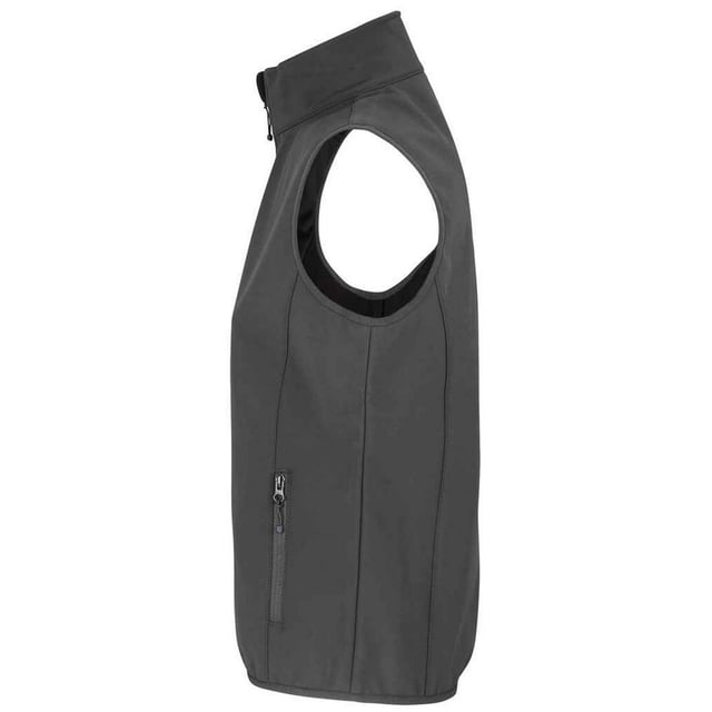 Outer Materials: 94% Recycled Polyester, 6% Elastane. Lining: Fleece, Polyester. Fabric: Softshell. Design: Plain. Fabric Technology: Breathable, Waterproof, Windproof. Bound Armholes, Chin Guard, Elasticated Arm Holes, Inner Zip Guard, Tearaway Label, Three Layers. Sleeve-Type: Sleeveless. Neckline: Standing Collar. Pockets: 1 Chest Pocket, 2 Lower Pockets, Zip. Fastening: Full Zip. Hem: Bound, Elasticated. Sustainability: Amfori, BSCI, Fair Wear Approved, GRS Certified, Oeko-Tex Standard 100 Certified, PETA-Approved Vegan, REACH.