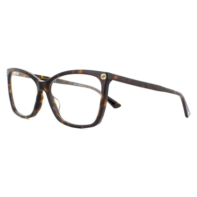Gucci Glasses Frames GG0025O 002 Dark Havana Women are a gorgeous cat eye style crafted from lightweight acetate and features the interlocking Gucci GG logo on the frame corners, and the bee logo on one temple tip.