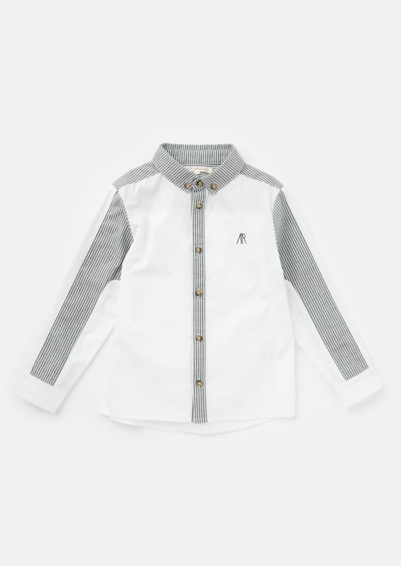Our   shirt re-mix! Cut and sew colourblock mixing clean   poplin with a classic ticking stripe. Smart dressing! About me: 100% Cotton Angel and Rocket cares: I'm made from Sustainable Cotton Look After Me: Think Planet. Wash At 30C.