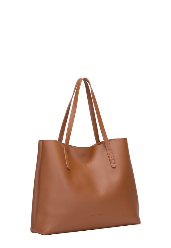 Let simplicity be key with the ophelia tote bag, perfect for taking your look through the week. In a range of colours this tote is made from unlined pu making it lightweight and spacious. With simple design features such as the claudia canova debossed logo, this bag is perfect for everyday sleek style. The bag fastens with a mag-dot clasp and inside reveals an inner pouch with a zip fastening to keep all your daily essentials safe. Features: , unlined pu, claudia canova debossed logo, mag-dot clasp fastening, twin grab handles, soft and flexible shape, removable inner pouch with zip fastening