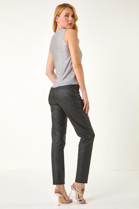 Metallic Cut Out Knitted Vest from Roman. Look effortless this season in our cut-out knitted vest perfect for the Autumn Winter. With a feminine round neckline and v-shaped cut-out detail, this sleeveless style is crafted from a soft lurex knitted fabric with a stunning metallic look. Pair this trendy piece with jeggings and ankle boots for a fashionable fall look!