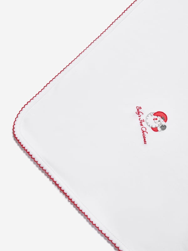 Introducing the Baby Winking Santa Receiving Blanket in White by Magnolia Baby - an essential piece for your Baby Unisex nursery. This blanket merges luxury and comfort, ensuring your baby feels wrapped in love.  Enchanting Design: Featuring an irresistibly cute winking Santa print, this blanket will become a charming focal point in your baby's nursery. Relaxed Comfort: Crafted from plush, high-quality fabrics, this blanket promises to provide unparalleled coziness that your baby will love.  Elevate your Baby Unisex nursery with the Baby Winking Santa Receiving Blanket in White from Magnolia Baby. Purchase now to let your little one bask in premium comfort and style!