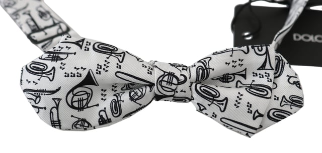 DOLCE & GABBANA Instruments Print Silk Bow Tie
  100% authentic and brand new with tags
  Exclusive item from the Dolce & Gabbana collection
  White Instruments Print
  Made of 100% silk
  Adjustable length neck strap
  One size fits all
  Made in Italy
Material: 100% Silk