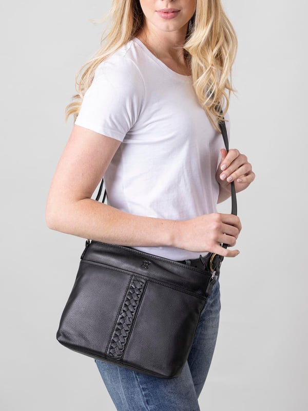 Perfect for carrying your everyday essentials, no matter the season, the Farlam Leather Cross Body Bag in black is a handbag necessity. Easy to co-ordinate with any outfit, it's equally practical and stylish. We've added to the classic silhouette with an intricate plait detail, and of course used the softest leather to create your new favourite handbag.