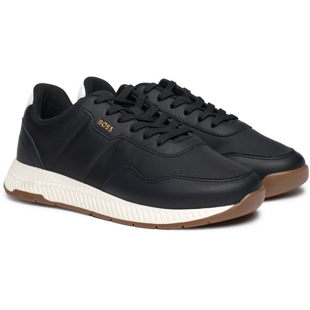 A Classic Running Shoe With An Urban Edge, The Boss Titanium Runn Trainer Is Crafted From Quality Materials And Made To Stand Out, Featuring A Sleek, Black Upper, A Golden Embossed Logo, Cushioned Footbed And A White Running-style Outsole And Heel Pad. These Designer Trainers Will Be Sure To Keep You Ahead Of The Race.