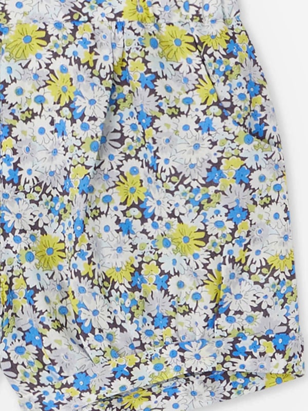 Introducing the Baby Girls Short Square Floral Shorts in Blue, a magnificently chic addition to your little girl's closet. Perfect for enhancing her charm in any setting. The key attributes that distinguish this piece are: Exquisite Design: adorned with a trendy and whimsical print, this unique piece instantly adds a pop of colour and style.  Premium Comfort: Made from superior quality materials, offering optimal comfort for your baby girl throughout the day.  Chic Appeal: Elevate your baby's fashion quotient with these lovely floral Bonpoint shorts. Grab them today and let your princess captivate every heart with her irresistible charm!