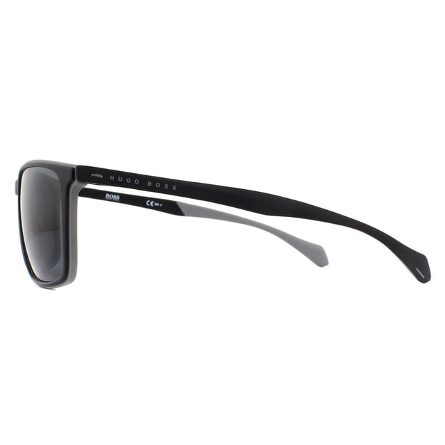 Hugo Boss Sunglasses 1114/S O6W IR Dark Grey Grey are a classic and versatile rectangular style made entirely of lightweight plastic. The outer edge of the frame front is coloured to match the Hugo Boss lettering on the temples and the inside of the temple tips.
