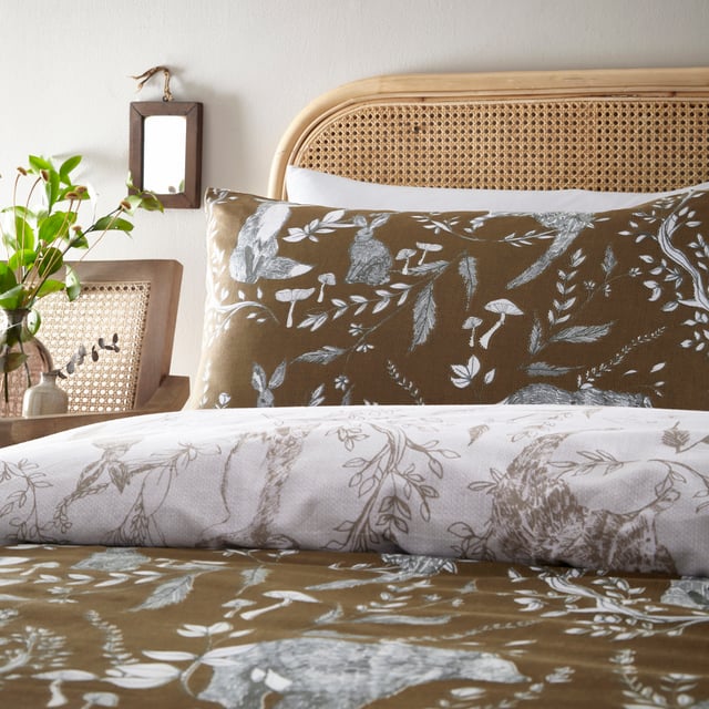 Explore our cosy and delicate take on the beauty of woodland creatures as you rest in the Buckthorn duvet cover set. Hand-drawn rabbits, foxes and bears pose among the delicate florals, which are set on an earth toned background. Flip the set over and the same design appears, but this time in inverted colours, giving you a fresh, evergreen look. An adorable and down to earth addition to your bedroom.