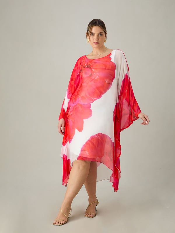 Printed all over with a striking red floral print, this kaftan dress is cut from a floaty chiffon with a soft jersey lining for comfort and coverage. It has a round neckline and loose, floaty sleeves, as well as a high-low hem thats endlessly flattering. Dress up or down, this is the perfect dress for holidays or weddings.