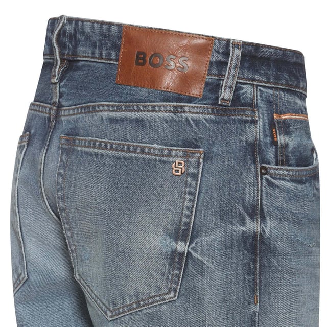 Mens BOSS Troy Selvedge Regular-Fit Jeans in blue.- Button closure.- Five pocket design.- Belt loops.- BOSS metal logo stud.- BOSS leather logo patch.- Top stitched.- Regular fit.- Ref: 50527222436