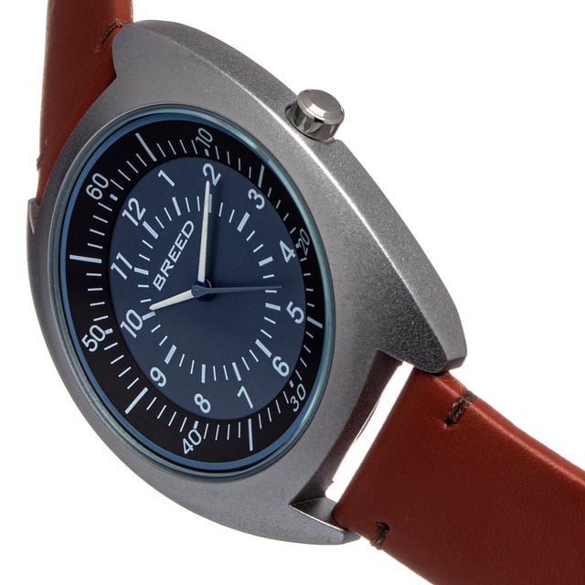 Matte Alloy Case; Japanese Seiko PC21S Quartz Movement; Non-Glare Scratch-Resistant Mineral Crystal; Logo-Engraved Stainless Steel Caseback; Genuine Leather Strap; Logo-Engraved Stainless Steel Clasp; Luminous Hands; 43mm Diameter; 5 ATM Water Resistance;