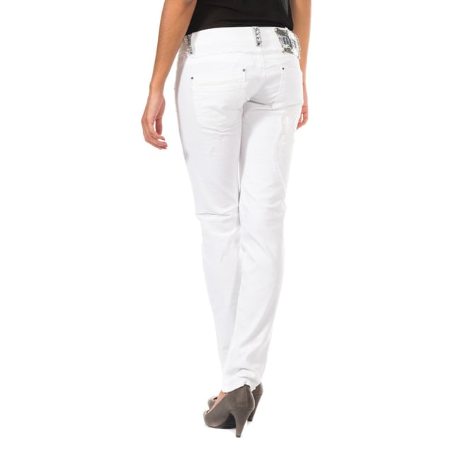 Long denim pants.
 Zipper and button closure on the front.
 Waist with belt loops.
 Loops with rhinestone application.
 Two open pockets and mini pocket on the front.
 Open pocket application with rhinestone detail on one side of the front.
 Application of patches with rhinestones.
 Custom label application by the brand, on the side of the waistband.
 Zipper and button closure application on the side of one of the bottoms.
 Skinny cut bottoms.
 Seams seen in tone.
 Composition: 97% Cotton.- 3% Elastane.
 Care:
- Wash maximum at 40ºC.
 - Iron at medium temperature, max. 110ºC.
 - Allows you to use a dryer.
 - Do not use bleach.
 - Does not support dry cleaning.