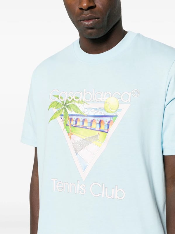 Casablanca's graphics often depict a fantastical world of sporty utopian scenes. The illustrative print on this organic cotton T-shirt portrays a Mexican-inspired landscape with a tennis court in the middle.