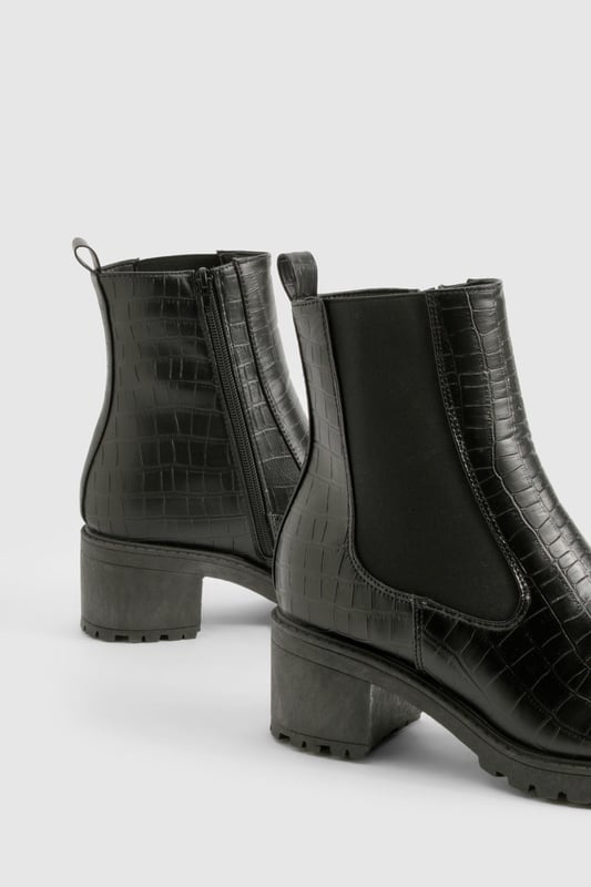 Crocodile-embossed texture for a luxe finish
        Chelsea-style with elastic side panels for easy on-off
        Chunky block heel measuring between 2.5 and 4.5cm
        Pull tab at the back for convenient wear
        Durable treaded sole for enhanced grip
    
    Step out in style with these versatile Chelsea boots, perfect for the fashion-forward woman who values both comfort and trend-setting looks. The crocodile-embossed texture adds a touch of sophistication to any outfit, while the elastic side panels ensure a snug fit and easy wear. Pair these boots with skinny jeans and an oversized jumper for a casual day out, or dress them up with a flowy midi skirt and leather jacket for an evening with friends. The low block heel offers just the right amount of lift without compromising on comfort, making these boots ideal for all-day wear. Whether you're heading to a family gathering or a casual catch-up with mates, these Chelsea boots will keep you looking effortlessly chic and feeling confident. Their robust construction and timeless design make them a wardrobe staple that you'll reach for season after season.