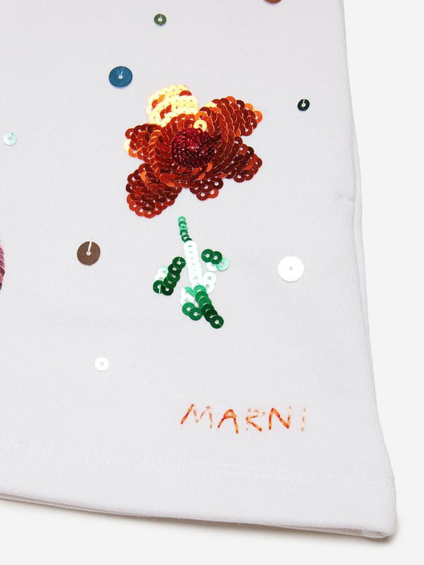 Marni embody innovation and high quality detailing in their sleek, everyday pieces. These girls shorts are a captivating summer piece to invest in. Envisioned in beautiful fleece with an elasticated waist and Sunny Day print embellished with sequins. They are accentuated by contrasting colour and an embroidered logo on the front.  Front Pockets On Both Sides 100% Cotton Application: 100% Polyvinylchloride Embroidery: 100% Polyester