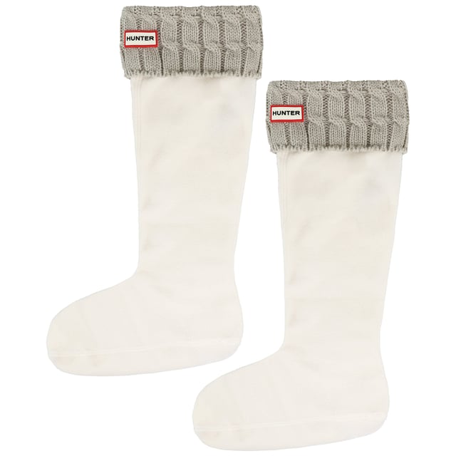 The Hunter 6 Stitch Cable Cuff Tall Light Grey Boot Sock is the perfect cold-weather accessory for your Hunter Tall Boots. Designed for extra warmth and a snug fit, these boot socks feature a soft fleece lining and a stylish chunky cable knit cuff for a cozy and sophisticated look.
Â 
Key Features:
Soft Fleece Lining: 

Provides warmth and comfort, keeping feet cozy in colder weather.


Chunky Cable Knit Cuff: 

Features a 6-stitch cable knit design for a classic winter aesthetic.


Fold-Over Cuff with Hunter Logo: 

Ensures a secure fit while adding a signature branded touch.


Designed for Tall Hunter Boots: 

Specifically made to complement Hunter Original Tall Boots for enhanced comfort and insulation.


Easy to Wear: 

Slips on effortlessly, improving the fit of your boots while adding an extra layer of warmth.


Versatile Light Grey Colorway: 

A soft, neutral shade that pairs seamlessly with a variety of Hunter Boots and winter outfits.


Â 
The Hunter 6 Stitch Cable Cuff Tall Light Grey Boot Sock is a stylish and practical addition to your winter wardrobe, ensuring maximum warmth and comfort while enhancing the fit of your favorite Hunter Tall Boots.