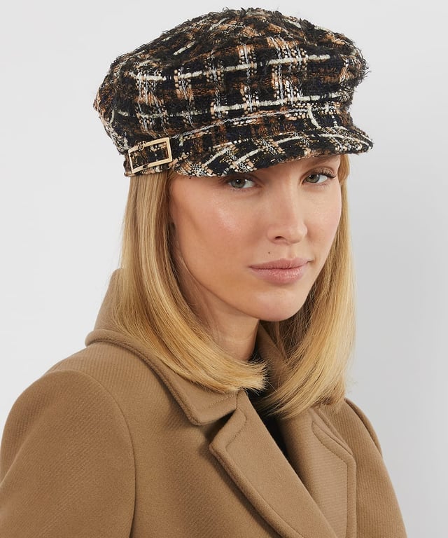 Refresh your cold-weather collection with Fabby, a textured hat that's bound to get you noticed. This hat is part of a curated collection using our chocolate boucle, complete with elegant gold thread accents Dune London metal branding, it adds a luxurious edge to your winter outfits.