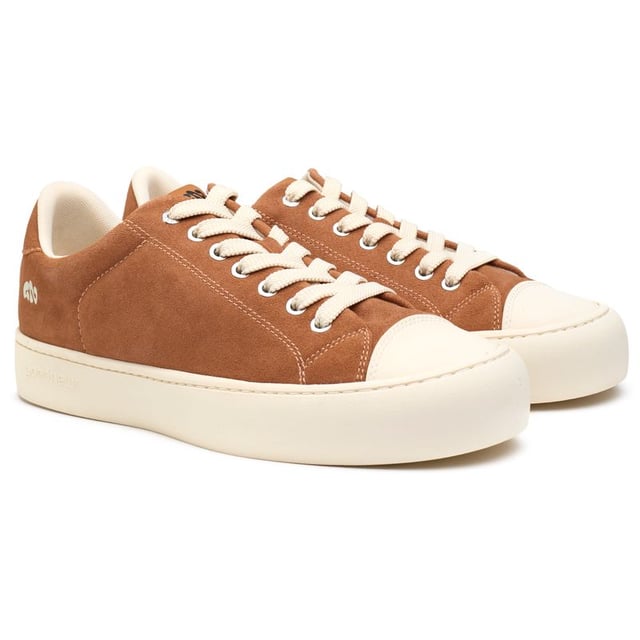 Step Up Your Eco-game With The Good News Slimer Trainers. Sporting A Sleek Tan Hue, These Court-inspired Kicks Boast A 100% Recycled Mesh Lining, Ensuring Your Steps Tread Lightly On The Planet. Crafted With Breathable, Cushioned Footbeds And A Unique Round-toe Shape, They Offer Unmatched Comfort. The 100% Copper Eyelets Add A Refined Touch, While The Robust Rubber Soles Promise Enduring Style. Stride With Pride In These Sustainable Standouts That Don't Compromise On Looks Or Values.