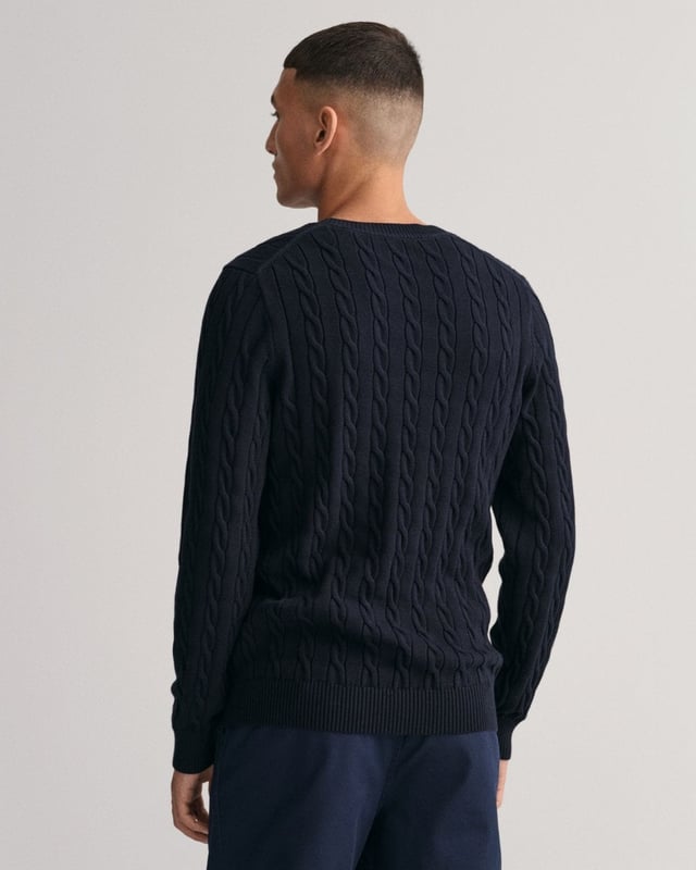 Designed in a soft cotton all-over cable knit, this sweater features our classic GANT shield embroidered at the chest, and ribbed endings at the hem and cuffs. A cable knit sweater adds a dimension of texture to your ensemble and pairs well with jeans and pants alike.
Regular fit  Crew neck  GANT graphic embroidered at chest
&nbsp;
Cotton 100%
&nbsp;
8050601
&nbsp;
&nbsp;