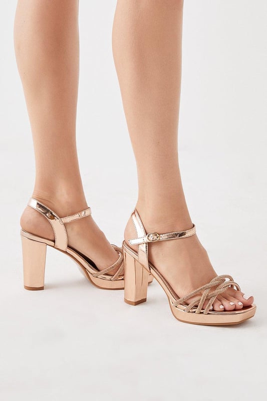 Taking you to new heights, heels can give you the confidence to feel like a brand new person. With lots of bold styles to choose from such as dazzling glitter slingbacks, feather embellished pumps, satin stilettos and cross-over platforms, our heel collection will have you planning your outfits from the feet up. Style: Taylor Diamante Platform Heeled Sandals.  Ideal for: Occasion.  Fit: Regular.