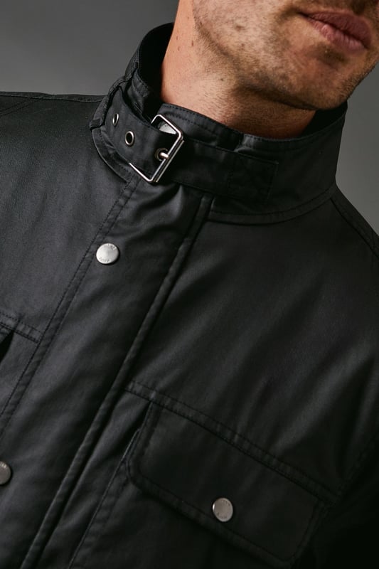 Waxed finish for a rugged, weather-resistant look
        Funnel neck design with snap closure for added protection
        Multiple front pockets for practicality and style
        Biker-inspired silhouette for an edgy appeal
        Versatile design suitable for various casual occasions
    
    This Maine waxed funnel neck biker jacket combines practicality with urban style. The waxed finish not only adds a rugged charm but also provides protection against the elements, making it perfect for unpredictable British weather. The funnel neck with snap closure offers extra warmth and a contemporary look. Style it as seen on the model with a navy jumper and relaxed-fit jeans for a classic casual ensemble. This jacket is equally at home for a weekend pub lunch or an outdoor music festival. For a smarter casual look, pair it with chinos and a crisp shirt. The multiple front pockets add functionality, allowing you to keep your essentials close at hand. Whether you're heading to a family gathering or a casual night out with mates, this versatile jacket will keep you looking effortlessly cool while braving the elements in true British style.