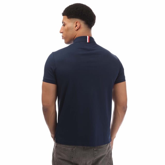 Mens Tommy Hilfiger Regular-Fit Polo Shirt in blue.- Polo collar.- Short-sleeved.- Two-button placket.- Tommy Hilfiger branding.- Tommy Hilfiger flag embroidery on chest.- Regular fit.- Ref: MW0MW35585DAF
