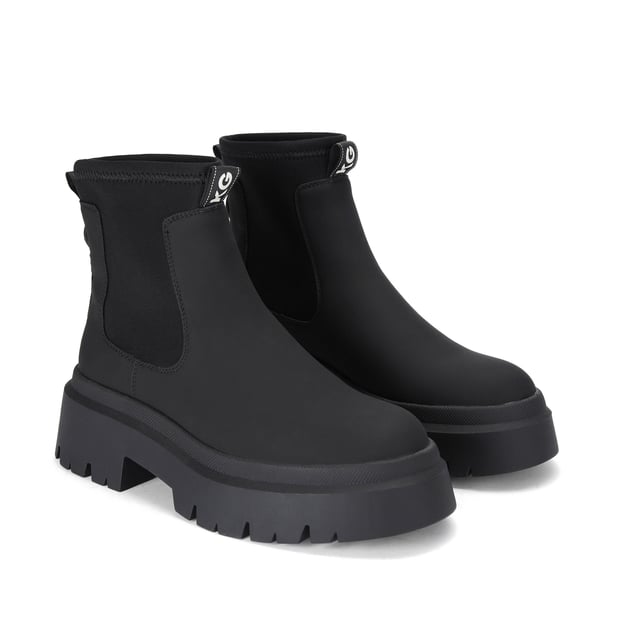 The Thea2 is a black boot with chunky style, there is a stretch ankle for slip-on ease. The sole is extra chunky with large tread. The back of the ankle features a brown monocle and KG Kurt Geiger branded tape.