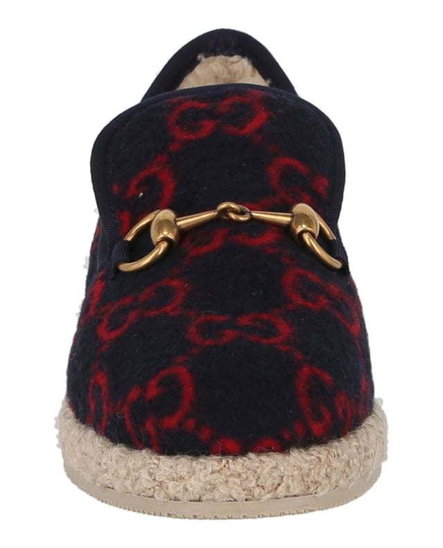 Heel measures at approximately: 0.4"; Slips on; 100% wool; Closed round toe,fur lining; Embellished with signature horsebit and knitted GG pattern;