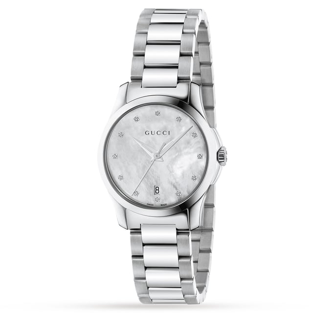 This expertly crafted ladies Gucci watch from the Timeless Classic collection features an elegant 27mm Stainless Steel case which showcases diamond dot hour markers and a stunning white mother-of-pearl dial, all protected by Sapphire crystal glass.