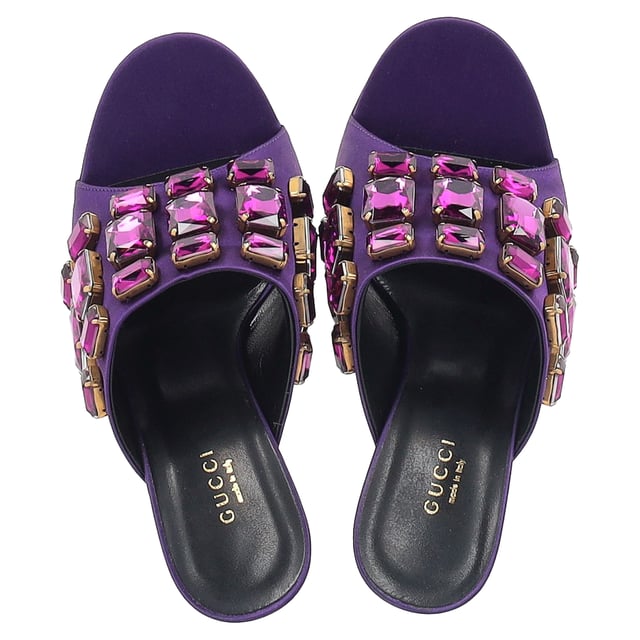 VINTAGE, RRP AS NEW

A perfect blend of luxury, style, and comfort, these designer mules are made using quality materials and elegantly frame your feet. They are designed with round open toes, block heels, and crystals that make them look elegant. They can be paired with a host of outfits from your wardrobe.

with box.

Gucci Tessa Crystal Embellished Peep Toe Mules in Purple Satin 
Condition: Excellent
Signs of wear: Include Box., No visible sign of wear. No Mark at insole.,  Very light mark at soles.
Packaging: Box
Color: Violet | purple
Material: Satin | crepe-satin
Size: EU | 39.5 / US9.5
Measurements: Heel height: 110; Insole length: 270
SKU: NAPPUGBSH422710W
